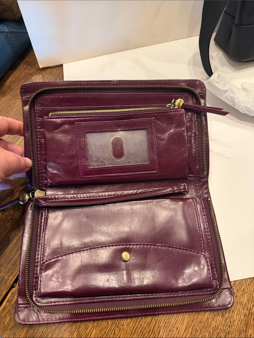 HOBO women’s Leather Clutch in Dark Plum